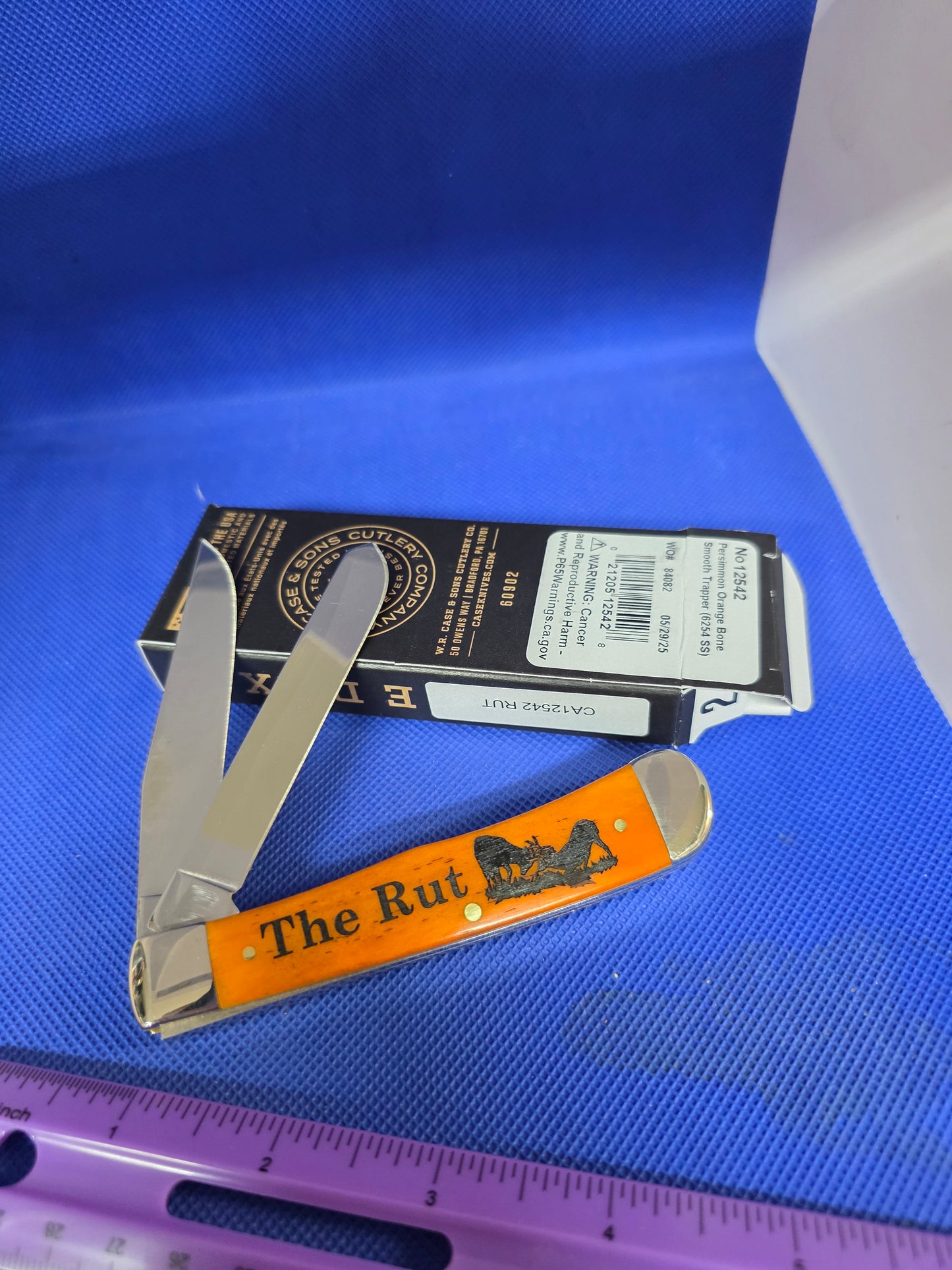 2025 Case XX Smooth Persimmon Bone Trapper RUT Scene CA12542 RUT