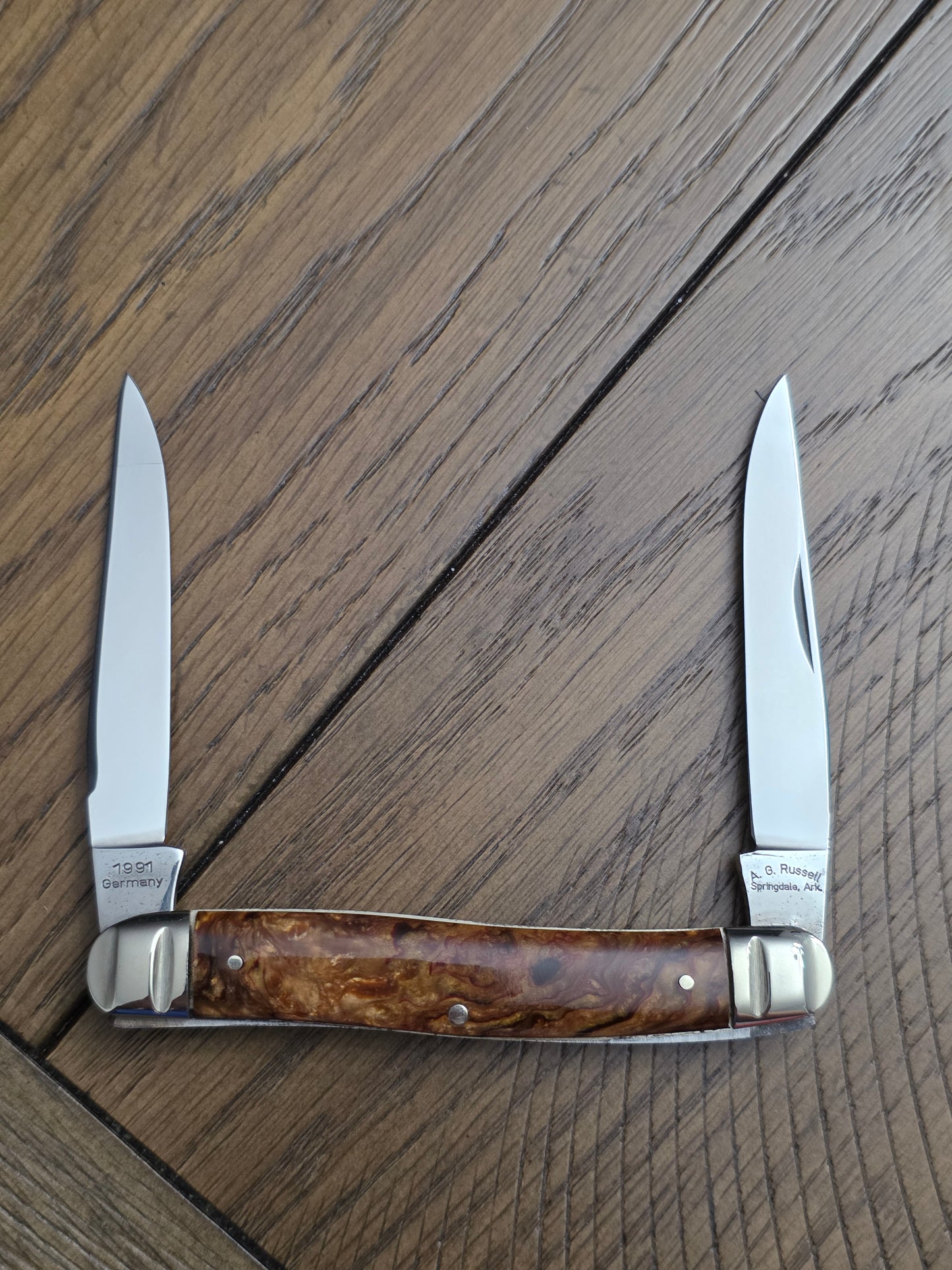 1991 A.G. Russell Muskrat with Butter & Molasses Handles - German Made - Acorn Shield