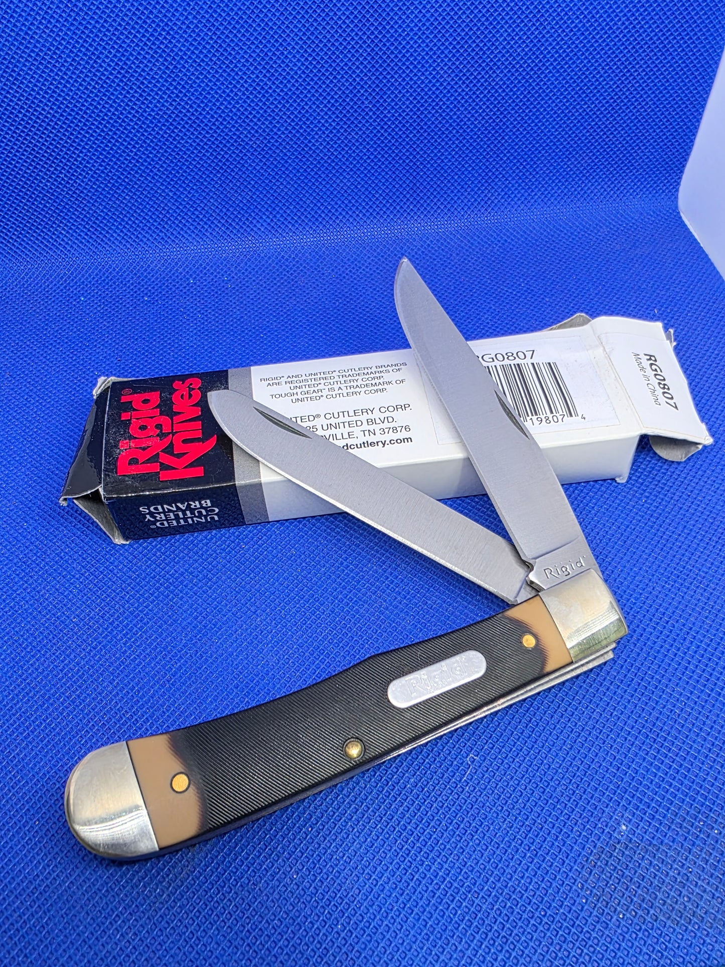 Rigid Trapper Sawcut Delrin Handles NIB RG0807 by United Cutlery